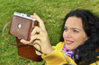 Brunette woman with old film photo camera collection