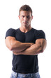 © theartofphoto - Muscled Man Crossing Arms with Serious Face