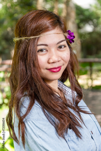 Filipina woman in a garden - Buy this stock photo and explore similar ...