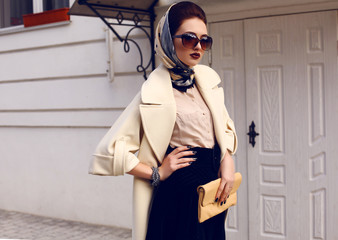 beautiful woman in elegant coat with accessories