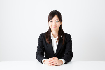 Wall Mural - asian businesswoman sitting on the table