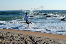 Man With Bait Casting Net