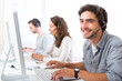 © Production Perig - Young attractive man working in a call center