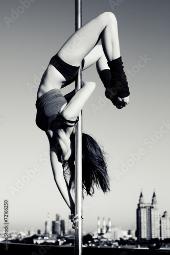 Fototapeta na wymiar Young pole dance woman