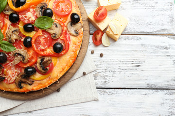 Wall Mural - Delicious pizza served on wooden table