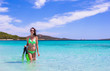 © travnikovstudio - Young woman with snorkeling gear on tropical beach