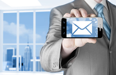 a man holding smartphone with one new message on a screen