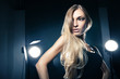 © julenochek - Beautiful woman posing at studio in light flashes