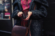 © LoloStock - Woman holding her wallet in the street