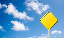 Blank Yellow Traffic Sign With Blue Sky Background
