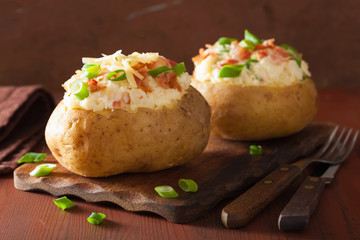 baked potato in jacket with bacon and cheese