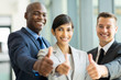 © michaeljung - business group giving thumbs up