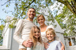 © Syda Productions - happy family in front of house outdoors