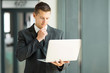 © michaeljung - businessman reading email on his laptop