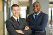 © michaeljung - businessman standing in front of colleague