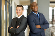 © michaeljung - young businessmen with arms crossed