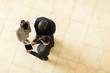 © michaeljung - above view of business people having meeting