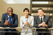 © michaeljung - group of business people standing by stairway