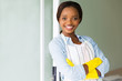 © michaeljung - young african woman wearing apron