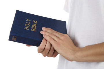 Canvas Print - Man holding Bible isolated on white