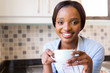 © michaeljung - african girl drinking coffee