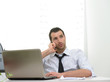 © Studio Gi - Businessman with laptop talking on the phone