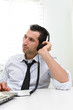 © Studio Gi - Businessman with laptop and headphones, selective focus