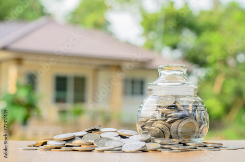 Fotografía money coins with home, Saving for buy home concept