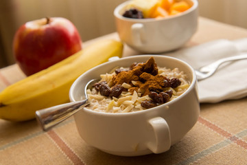 Wall Mural - Fresh fruit and oatmeal with healthy toppings for breakfast