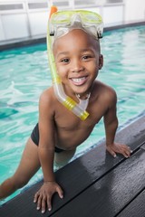 Cute little boy wearing snorkel and goggles