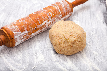 Wall Mural - Wooden rolling pin and a dough ball