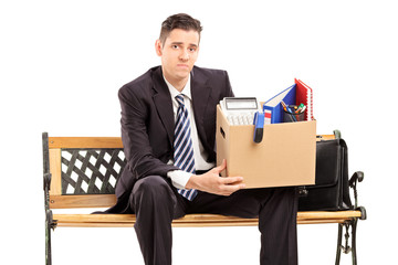 Sticker - Fired businessman holding a box with his stuff