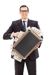 Sticker - Delighted businessman holding a briefcase full of money