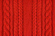 Knitted woolen background, red texture