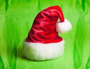 Santa Claus red hat on green background