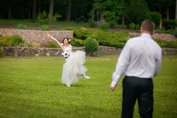 beautiful the couple in wedding day playing football