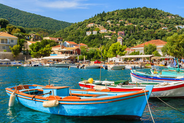 Colorful Greek fishing boats in port of Kioni on Ithaka island