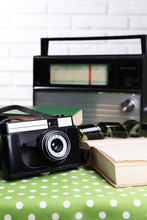 Retro Composition With Old Camera, Radio And Books, Close Up