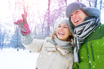 Wall Mural - Winter Vacation. Happy Couple Having Fun Outdoors