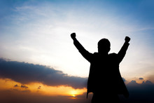 Silhouette Of Man Raising His Arms - Success & Winning Concept