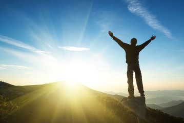 Wall Mural - winner on mountain top. sport and active life concept..