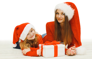 Christmas and people concept - happy mother and child with box g