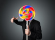 © ra2 studio - Businessman holding a lollipop