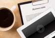 © ra2 studio - Tablet pc showing media player on screen with a cup of coffee on