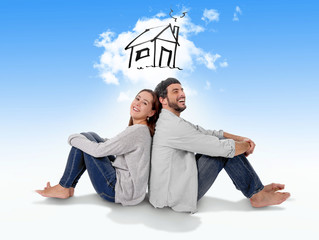 Young couple imaging new house in real state concept