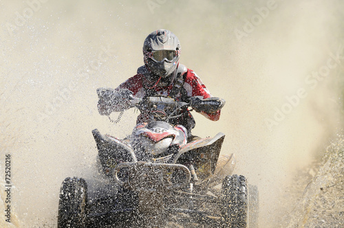 Fototapeta na wymiar quad crossing the river