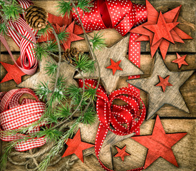 christmas decorations wooden stars and red ribbons. retro style