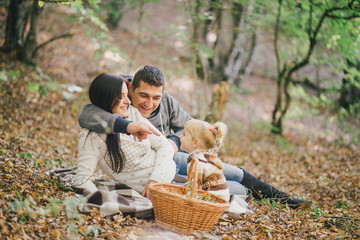 Wall Mural - Happy family in an autumn forest