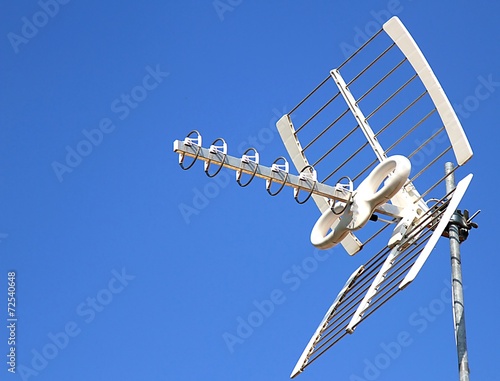 Fotografie, Tablou Antenna TV aerial for reception of TV channels and the blue sky