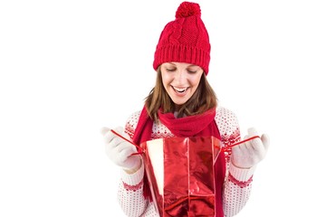 Wall Mural - Smiling santa woman looking into shopping bag